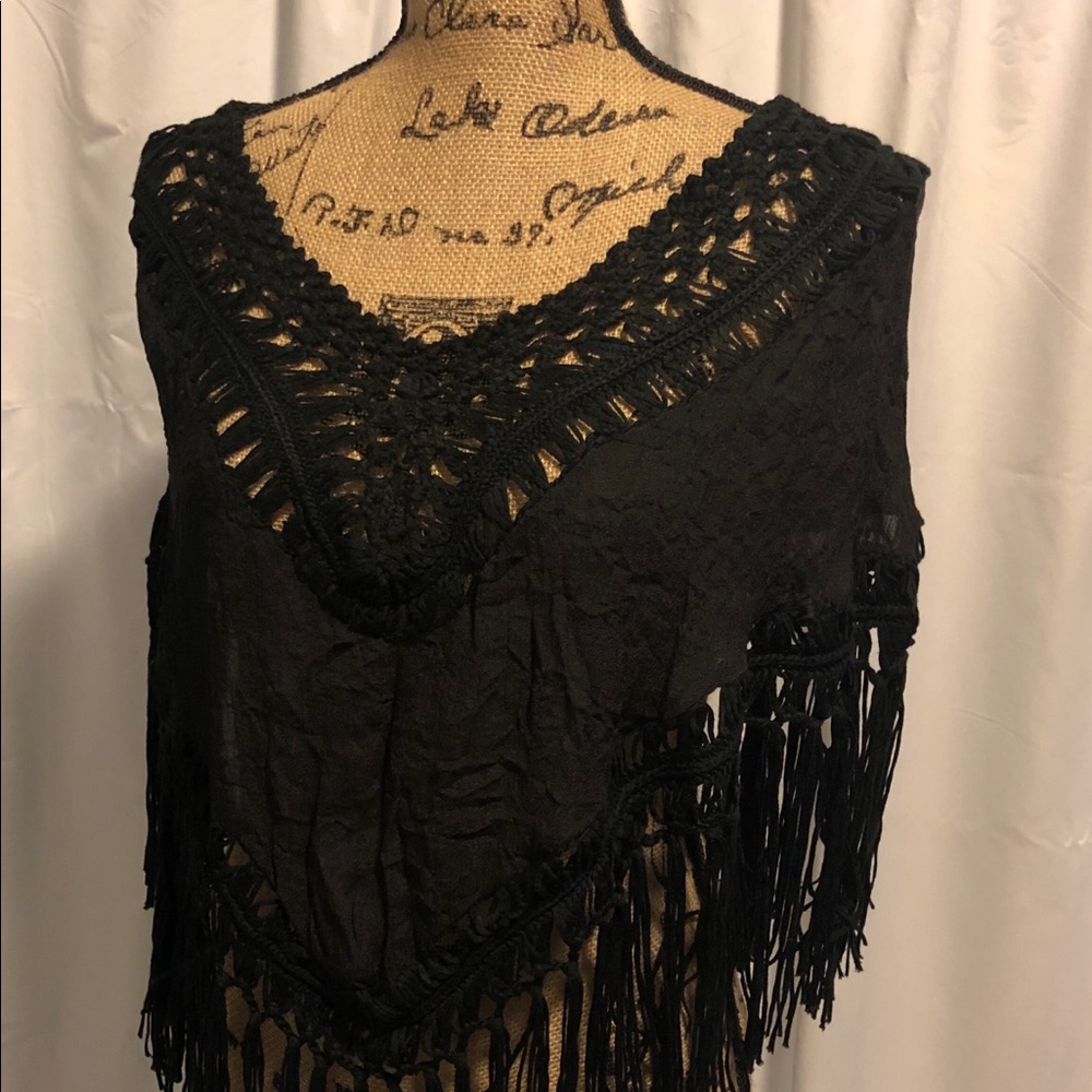 Poncho with tassel fringe design.